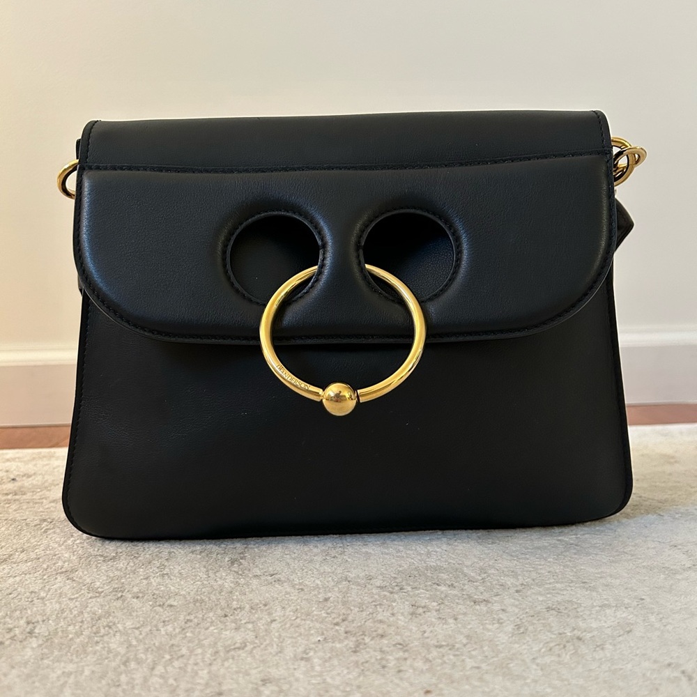 JW ANDERSON PIERCE black leather shoulder bag.